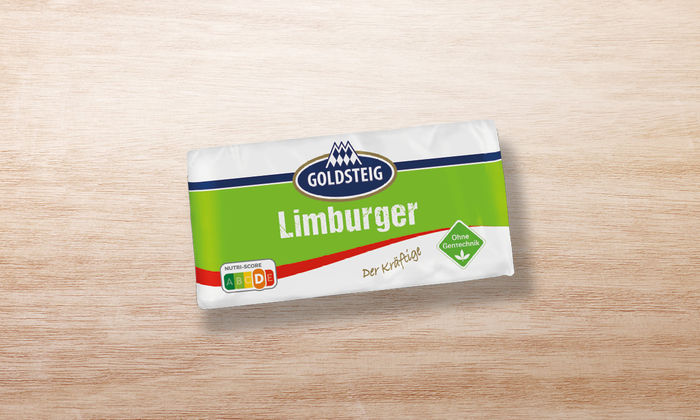 Limburger classic von GOLDSTEIG in Verpackung auf Holztisch