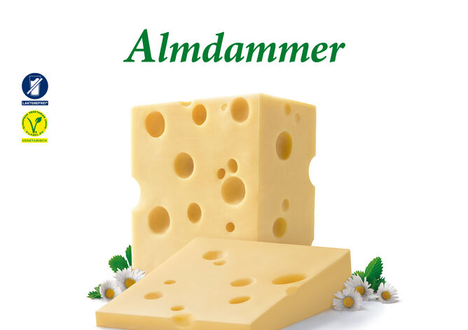 Almdammer Stück von GOLDSTEIG mit Gänseblümchen. Laktosefrei und Vegetarisch. 