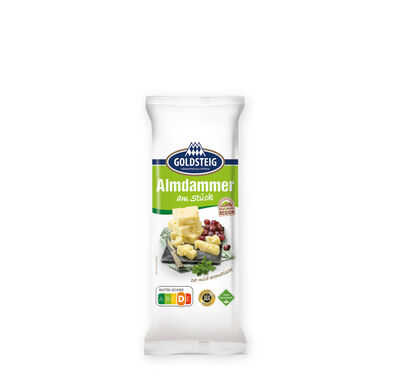 Almdammer Stück - GOLDSTEIG Käsespezialitäten Almdammer Stück von GOLDSTEIG in Verpackung