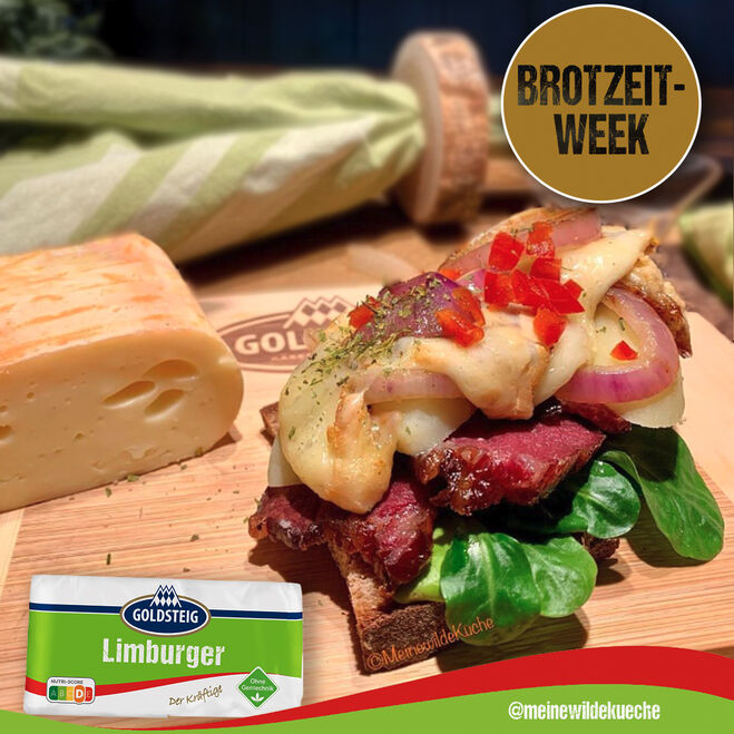 Aktionen & Neues (Aktionen-Neues) / Social-Media-Posts: Limburgerbrot mit GOLDSTEIG Limburger auf Holzbrett.