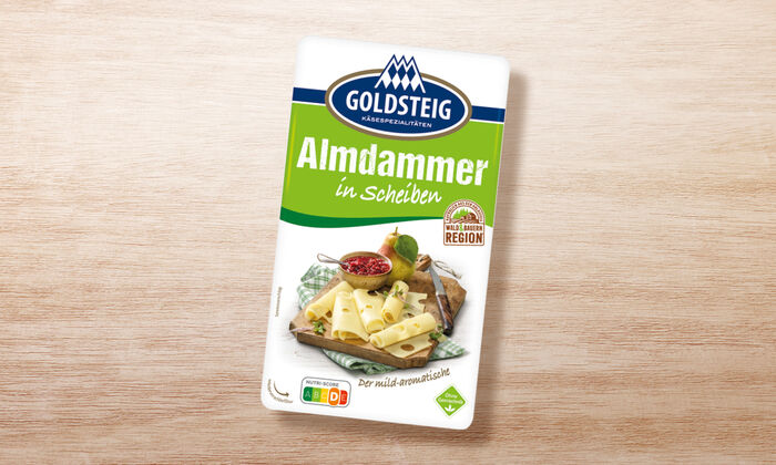 Almdammer Scheiben von GOLDSTEIG in Verpackung auf Holztisch