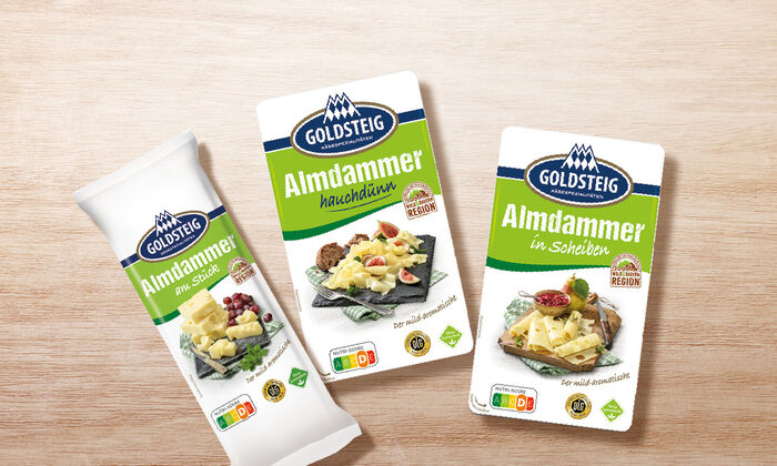 Almdammer Sortiment von GOLDSTEIG auf Holztisch